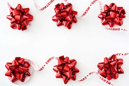 Red ribbon gift box isolated on white background.の写真素材