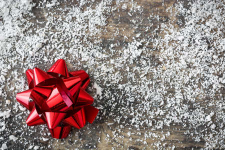 Red ribbons on wooden background.の写真素材