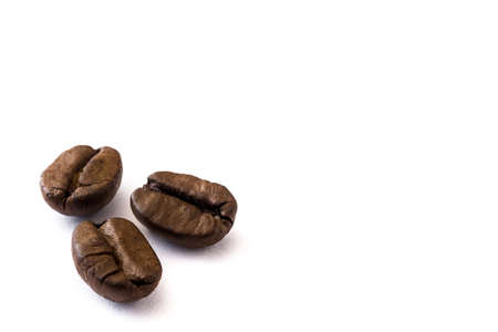 Close up of coffee beans isolated on white background. Copyspaceの写真素材