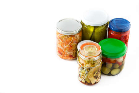 Fermented preserved vegetables in jar isolated on white background. Copyspace