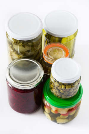 Fermented preserved vegetables in jar isolated on white background