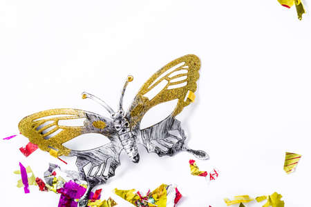 Carnival mask and colorful confetti on white background.の写真素材