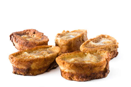 Traditional homemade Spanish torrijas isolated on white background. Easter dessert