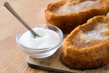 Traditional homemade Spanish torrijas on wooden background. Easter dessertの写真素材