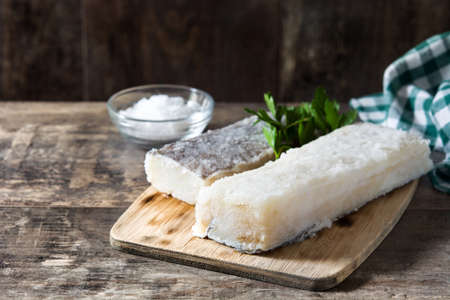 Salted dried cod on wooden table. Typical Easter foodの写真素材