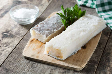Salted dried cod on wooden table. Typical Easter foodの写真素材