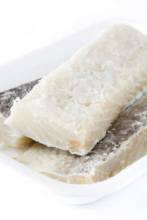 Salted dried cod isolated on white background. Typical Easter food