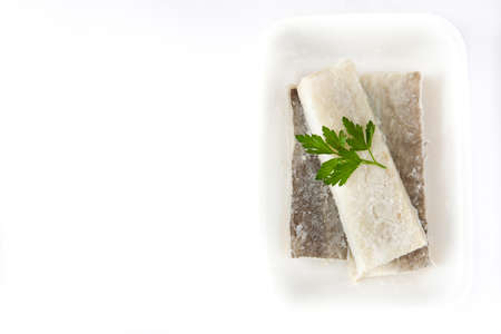 Salted dried cod isolated on white background. Top view copyspace.Typical Easter foodの写真素材