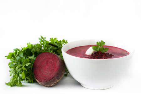 Beet soup in white bowl isolated on white background.の写真素材