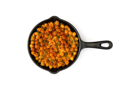 Fried spicy chickpeas in frying pan isolated on white background. Top viewの写真素材