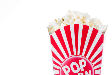 Popcorn inside the packaging striped isolated on white background. Copyspaceの写真素材