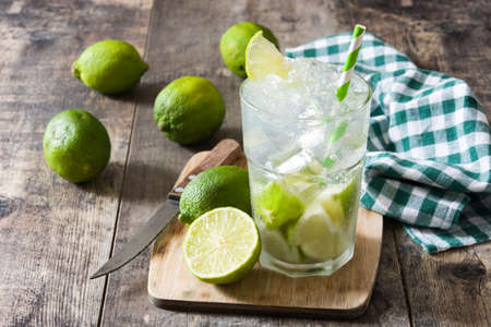 Caipirinha cocktail in glass on wooden table background.の写真素材