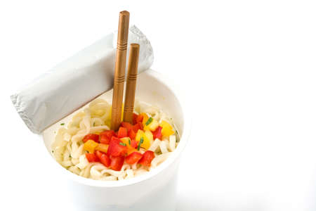 Take away noodles with vegetables isolated on white background. Copyspaceの写真素材
