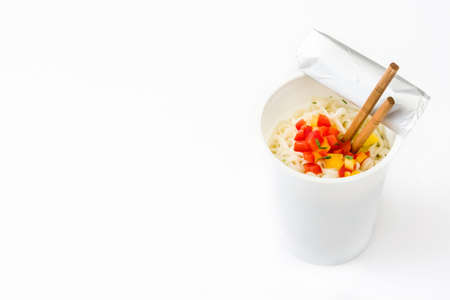 Take away noodles with vegetables isolated on white background. Copyspaceの写真素材