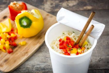 Take away noodles with vegetables on wooden tableの写真素材