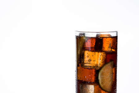 Cuba libre. Cocktail with rum, lime and ice on white background. Copyspaceの写真素材