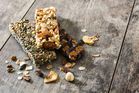 Muesli bars on wooden table. Copyspaceの写真素材