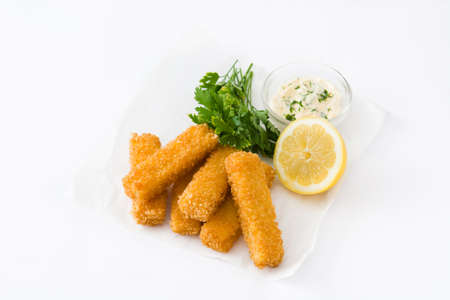 crispy fried fish fingers with lemon and sauce isolated on white backgroundの写真素材