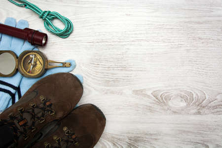 Hiking supplies on white wooden background. Top view Copyspaceの写真素材