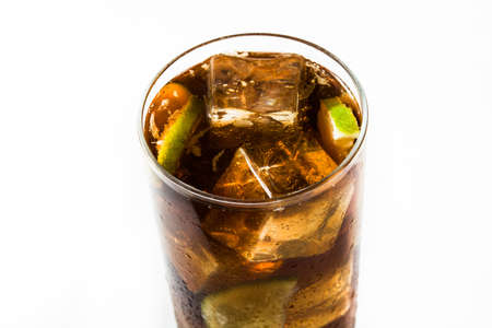 Cuba libre. Cocktail with rum, lime and ice isolated on white background.の写真素材