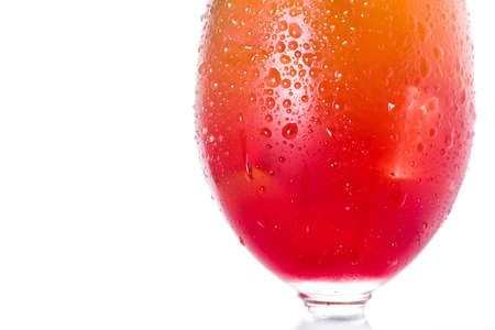 Sex on the beach cocktail in glass on white background. Close up Copyspaceの写真素材