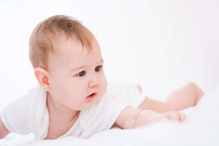 Adorable little baby girl on white background.の写真素材
