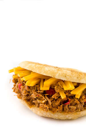 Arepa with shredded beef and cheese isolated on white background. Venezuelan typical foodの写真素材