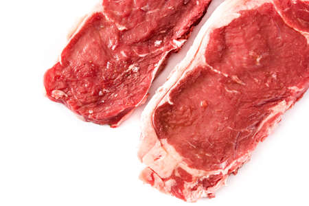 Raw beef steak ready to be cooked isolated on white background