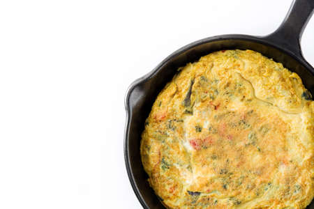 Frittata made of eggs and vegetables in a pan, isolated on white background. Top view Copyspaceの写真素材