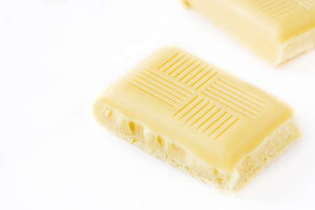 White chocolate bar isolated on white background. Close up