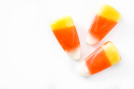 Typical halloween candy corn isolated on white background. Top view Close upの写真素材