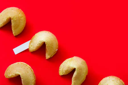 Fortune cookies pattern on red background. Copyspaceの写真素材
