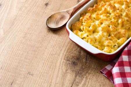 Typical American macaroni and cheese on wooden table. Copyspaceの写真素材