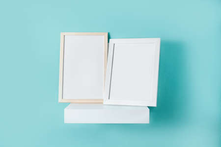 Frames mockup on turquoise wall.