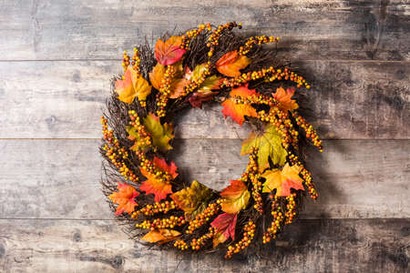 Autumn wreath on wooden background. Thanksgiving concept.の写真素材