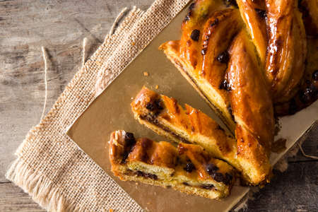 Homemade braid chocolate on wooden table. Top viewの写真素材