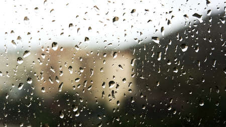 Rain water drops on the window backgroundの写真素材