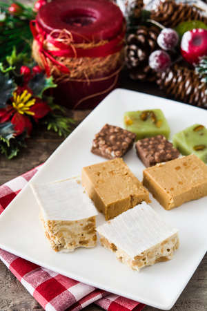 Christmas nougat on wooden table.