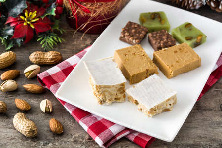 Christmas nougat on wooden table.の写真素材
