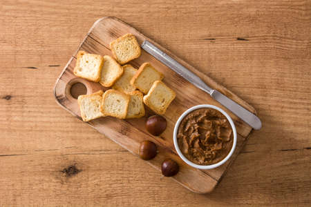 Chestnut cream on bowl rusty table. Top viewの写真素材