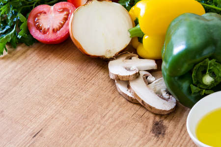Healthy eating.food diet.vegetables and olive oil on wooden table. Copyspaceの写真素材