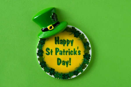 St. Patrick Day symbols on green background.
