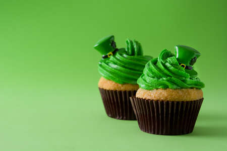 St. Patrick's Day cupcake on green background. Copyspaceの写真素材