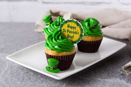 St. Patrick's Day cupcakes on gray background.の写真素材