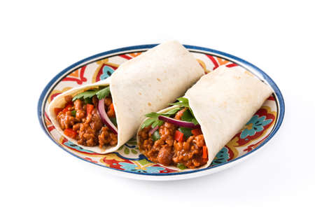 Typical Mexican burritos wraps with beef, beans and vegetables isolated on white background.の写真素材