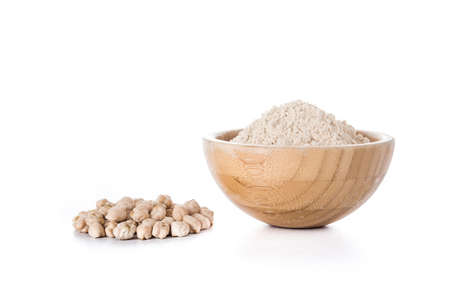chickpea flour in wooden bowl isolated on white backgroundの写真素材