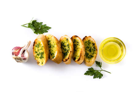 Garlic breads slice with ingredients isolated on white background. Top viewの写真素材