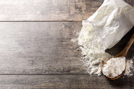 Flour bag on wooden table. Copyspaceの写真素材
