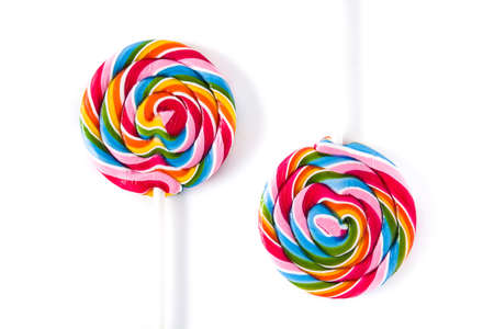 Colorful lollipops isolated on white background. Top view.
