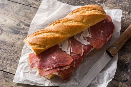 Spanish sandwich on wooden table.の写真素材